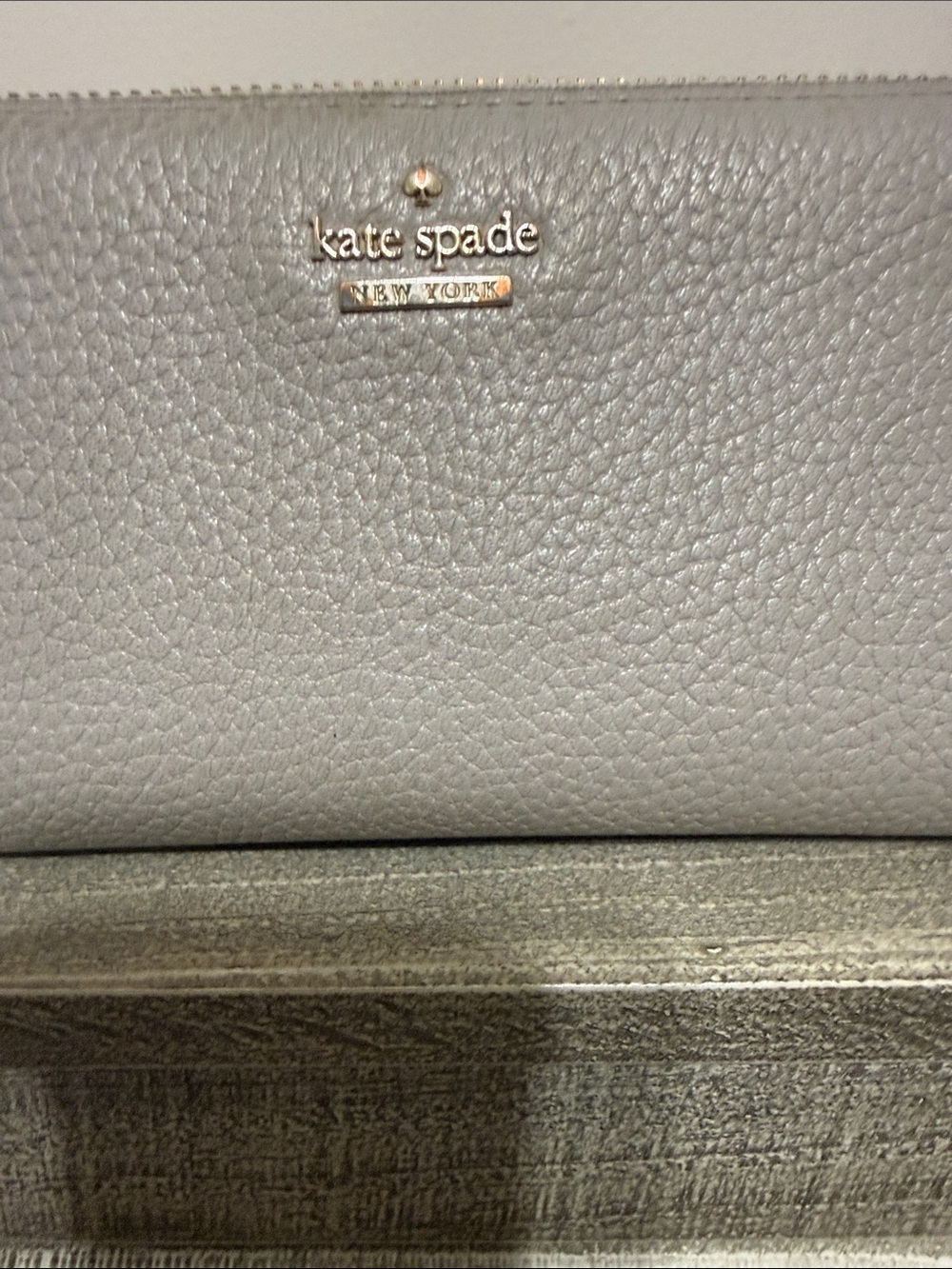kate spade Pebbled Leather Zip Wallet in Light Gray with Gold Logo